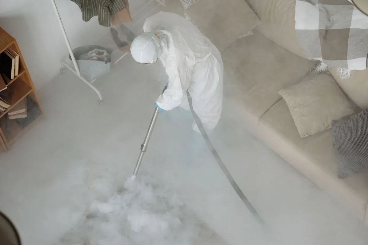 Biohazard cleanup technician in protective equipment, Ipswich, MA